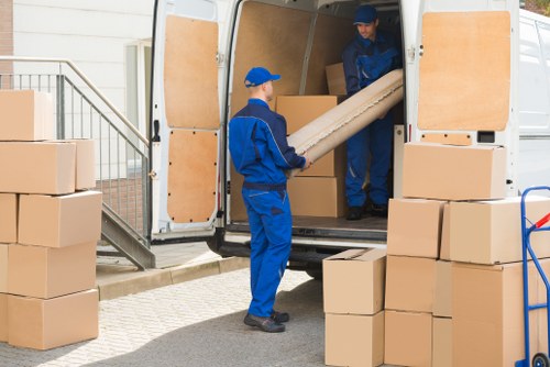 Professional team handling furniture pick-up in Elephant and Castle storage