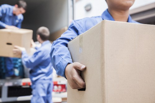 Professional packers organizing items for a move