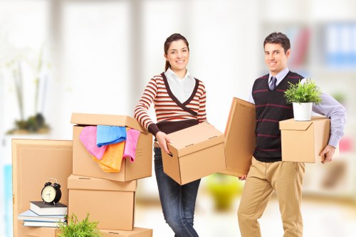 Movers packing belongings into a removal truck